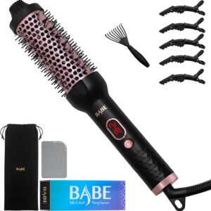 Heated round styling brush by BABE with included hair clips, detangling comb, heat-resistant mat, and velvet storage pouch.